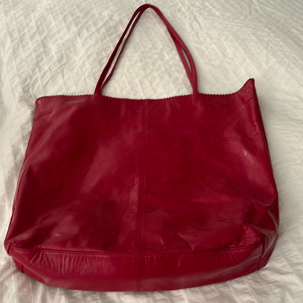 Latino leather tote bag burgundy color has some marks on one side see picture